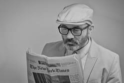 man reading newspaper