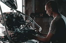 mechanic with engine
